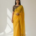 Yellow Linen Organza Saree with aari mirror work